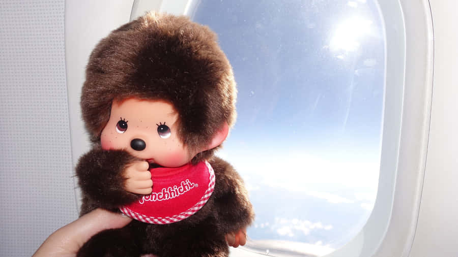 Monchhichi Doll In Airplane Wallpaper