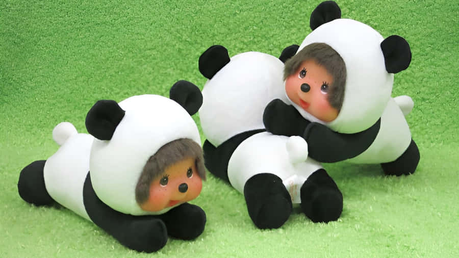 Monchhichi Dolls In Panda Costumes Wallpaper