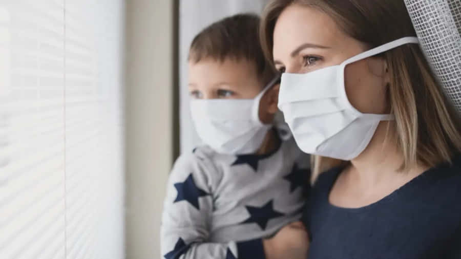Motherand Child Wearing Face Masks Wallpaper