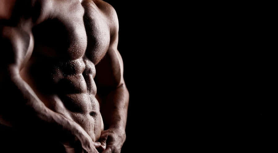 Muscular Torsoin Dramatic Lighting Wallpaper