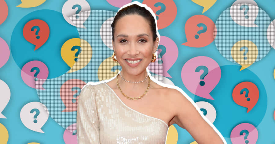 Myleene Klass Smiling Against Question Mark Backdrop Wallpaper
