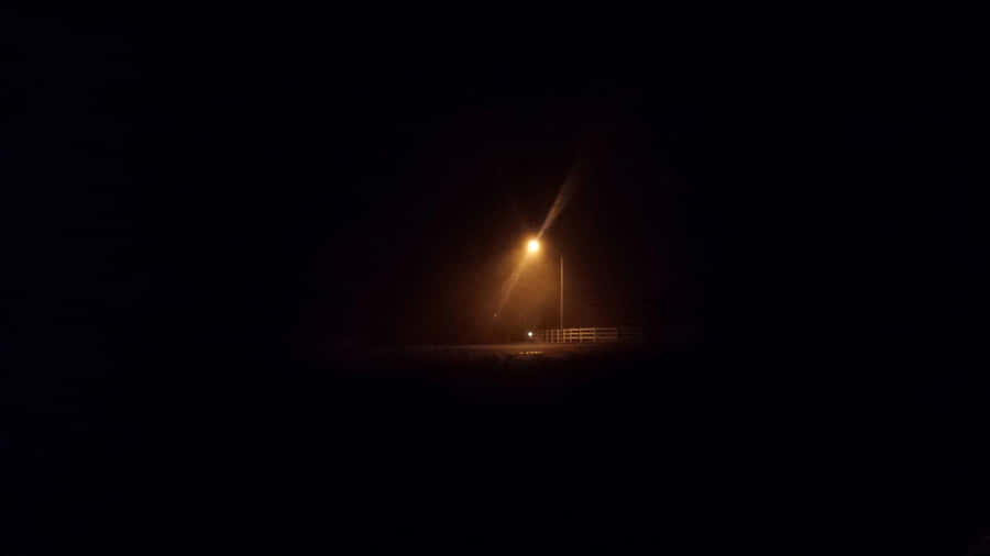 Mysterious Dark Crossroad At Night Wallpaper