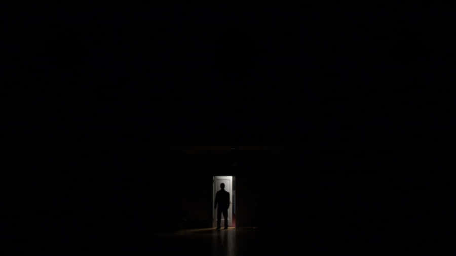 Mysterious Dark Room With A Single Light Source Wallpaper