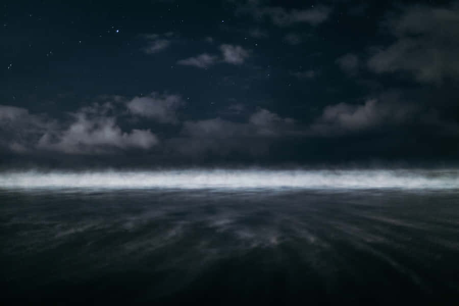 Mysterious Depths Of The Dark Ocean Wallpaper