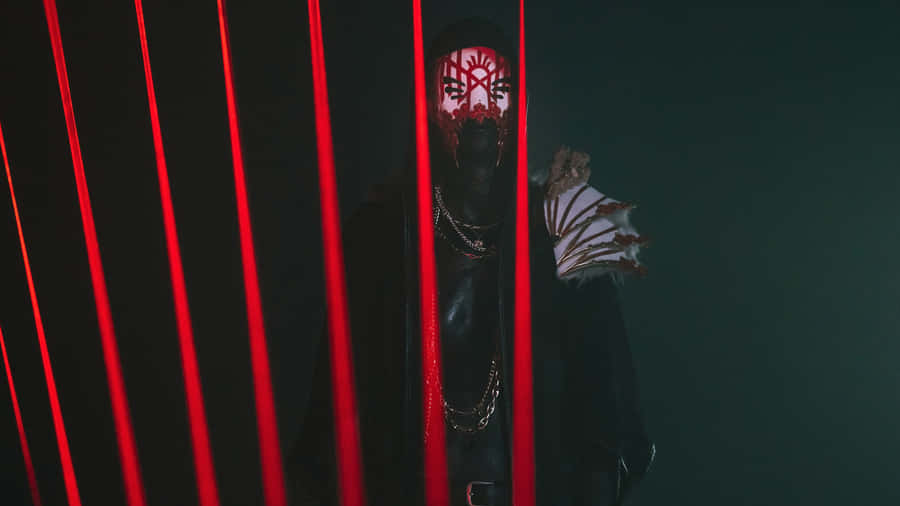 Mysterious_ Figure_ Behind_ Red_ Lights.jpg Wallpaper