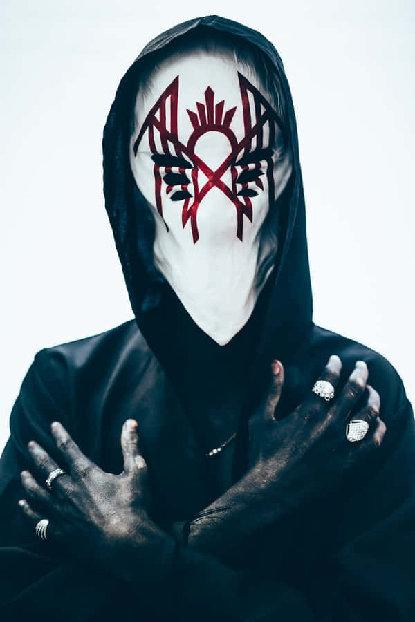 Mysterious_ Figure_with_ Masked_ Face_and_ Hood.jpg Wallpaper