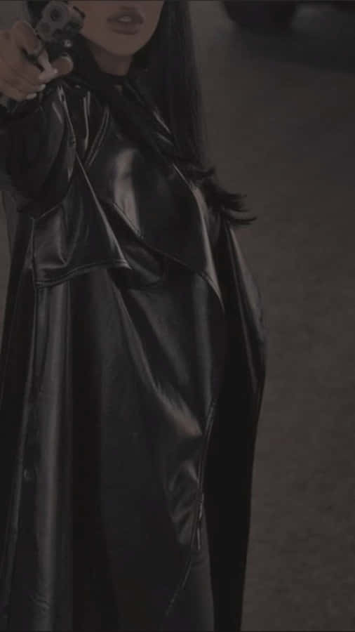 Mysterious Woman In Black Holding Gun Wallpaper