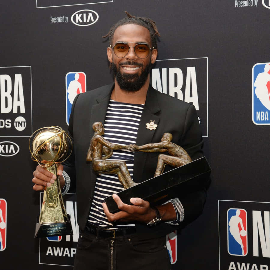 N B A Awards Winner Holding Trophies Wallpaper