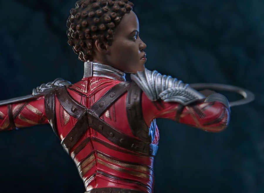 Nakia Radiates Power And Elegance In A Vibrant Setting. Wallpaper