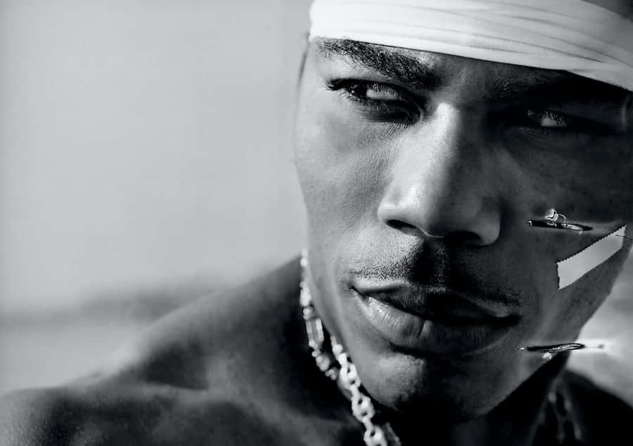 Nelly Thriving In The Spotlight Of His Career Wallpaper