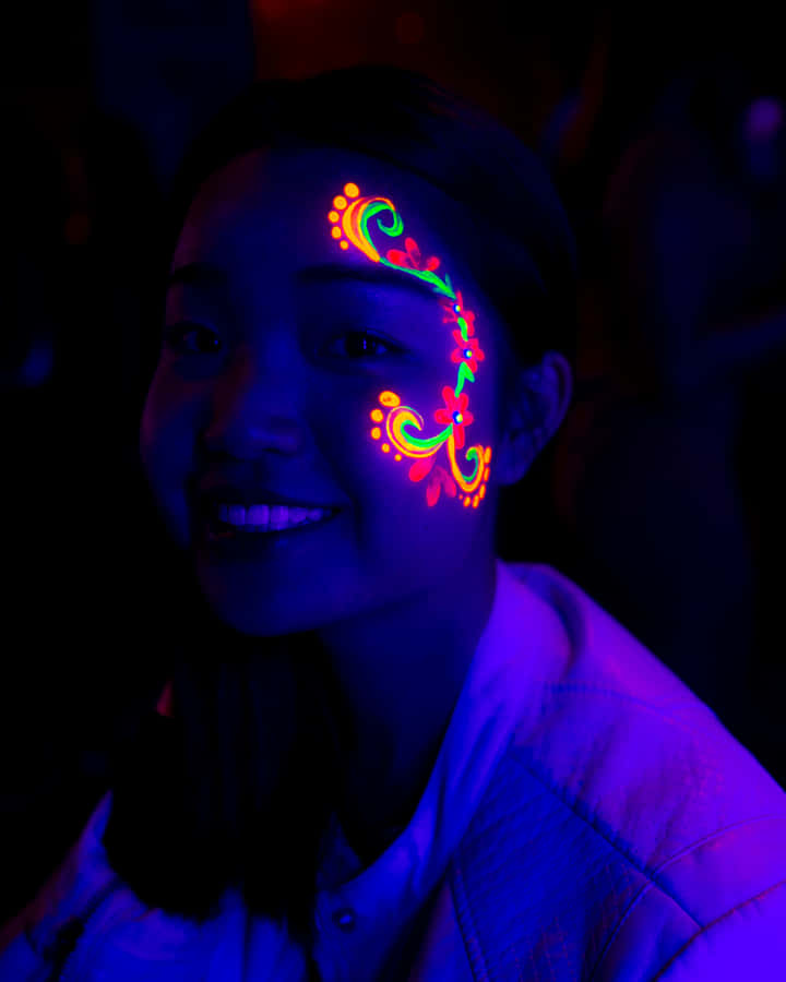 Neon_ Face_ Paint_ Under_ Black_ Light Wallpaper