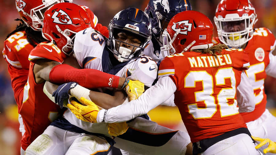 Nfl Players Are Fighting For The Ball Wallpaper