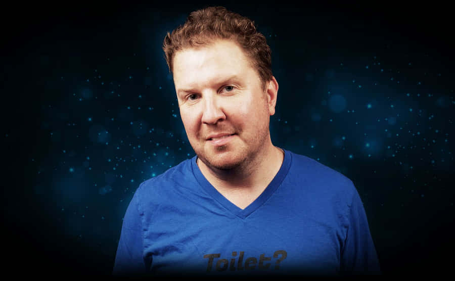 Nick Swardson Laughing On Stage Wallpaper