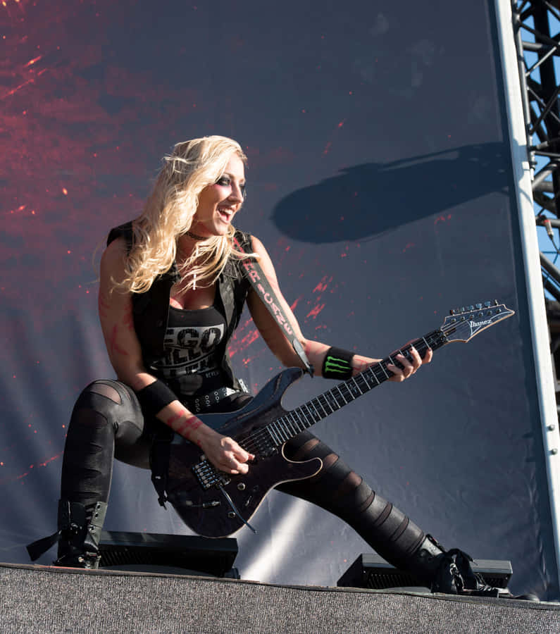 Nita Strauss Guitar Performance Wallpaper