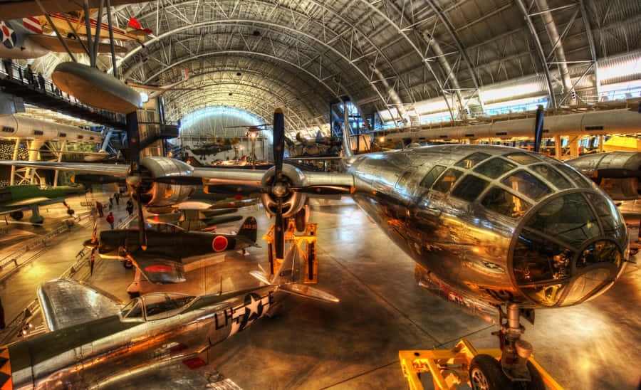 Nostalgic Skies - A Vintage Airplane Soaring High Wallpaper