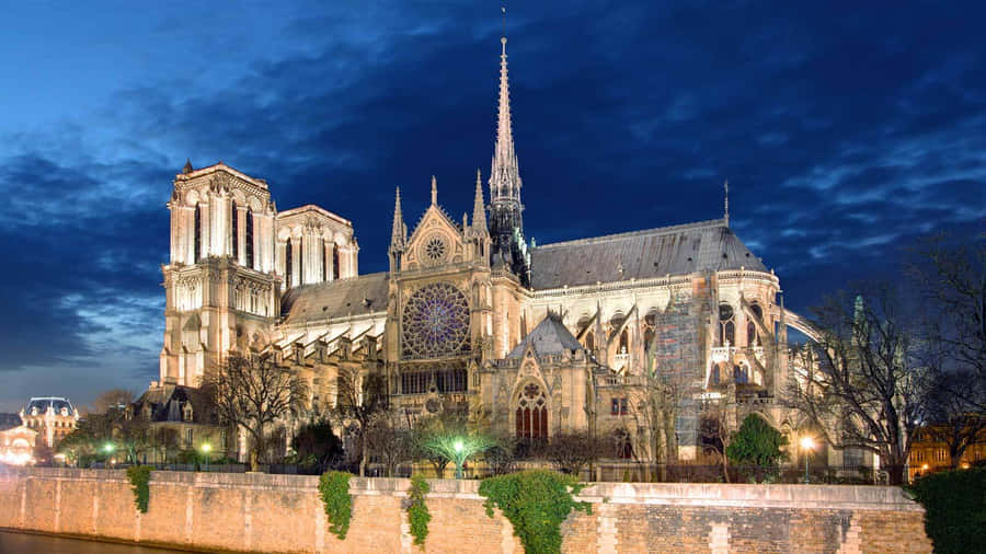 Notre Dame Cathedral Against Dark Blue Sky Wallpaper