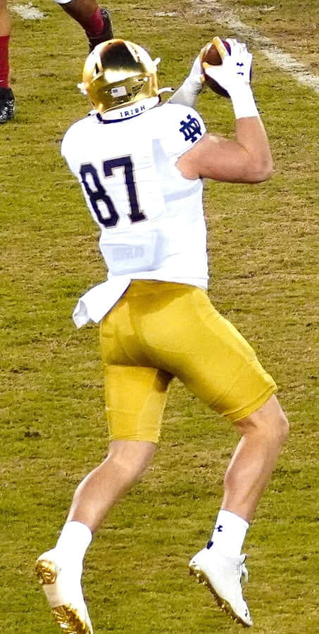 Notre Dame Football Player Catching Ball Wallpaper