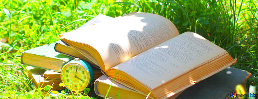 Novel And A Clock Wallpaper