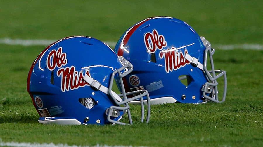 Ole Miss Football Helmets On Field Wallpaper