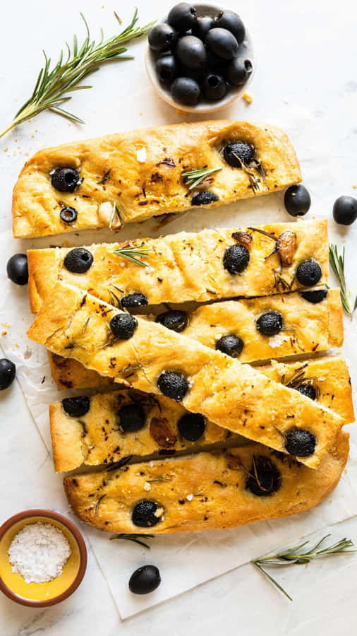 Olives Are Sprinkled Over A Plate, Forming A Delicious, Healthy Snack Wallpaper