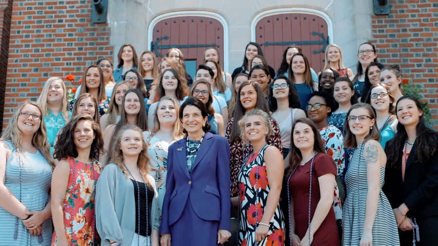 Olympia Snowe Posing On Steps Wallpaper