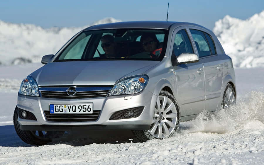 Opel Astra On Open Road Wallpaper