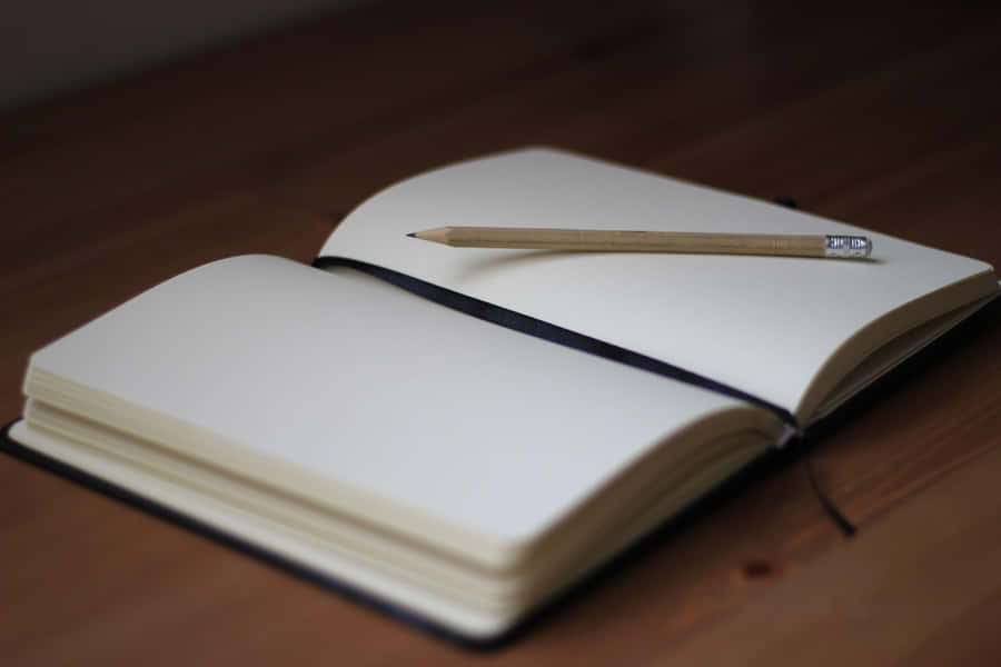 Open Notebookwith Pencil Wallpaper