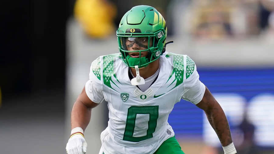 Oregon Football Playerin Action Wallpaper