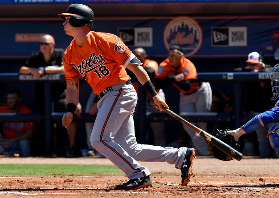 Orioles Player Swinging Bat Baseball Game Wallpaper