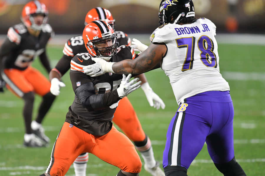 Orlando Brown Jr. Against Myles Garrett Wallpaper