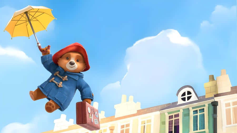 Paddington Bear Flying With Umbrella Wallpaper