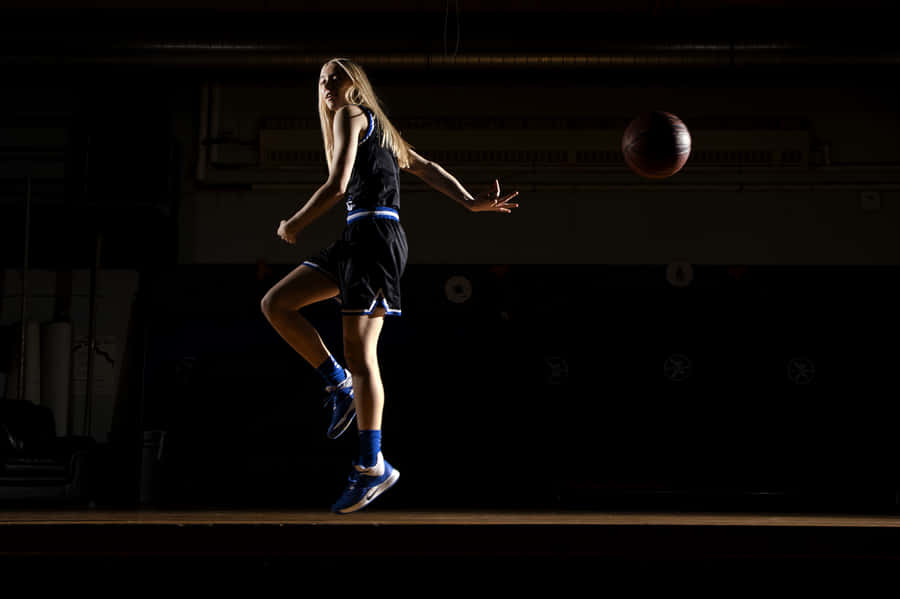 Paige Bueckers Basketball Action Wallpaper