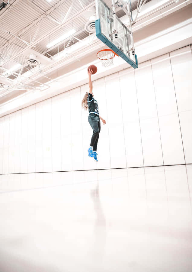 Paige Bueckers Basketball Dunk Wallpaper