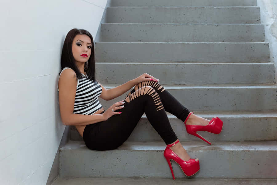 Pair Of Alluring Red High Heels Wallpaper