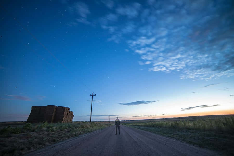 Palpable Silhouette Of Man On Road Wallpaper