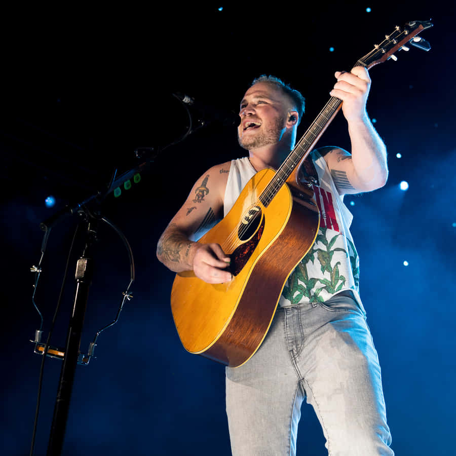 Passionate Guitarist Performing Live Wallpaper