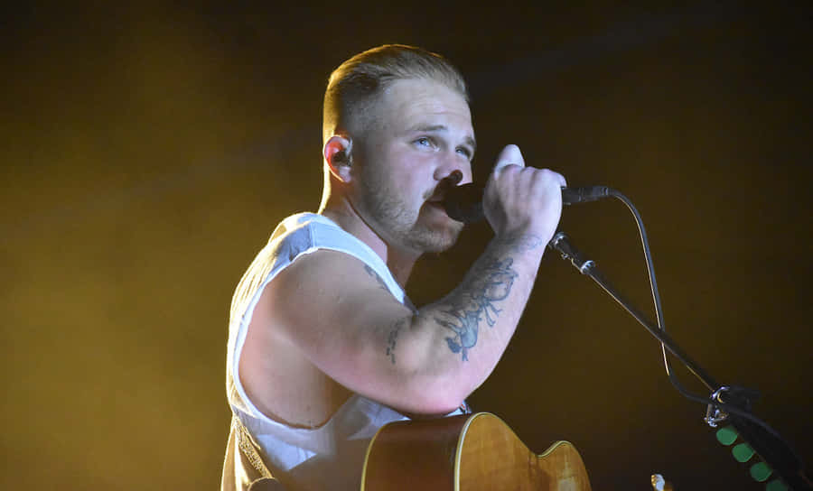 Passionate Singer Performance Live Stage Wallpaper