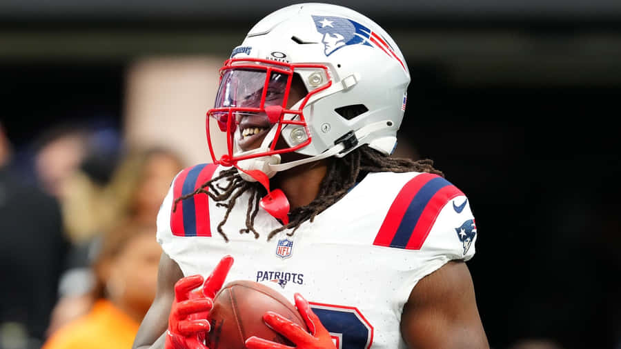 Patriots Player Smiling With Football Wallpaper