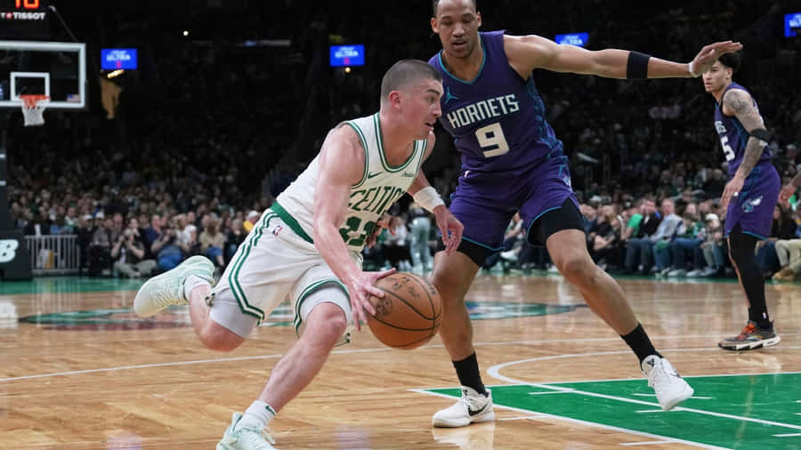 Payton Pritchard Driving To Basket Wallpaper