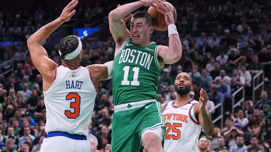 Payton Pritchard Shooting Over Defenders Wallpaper