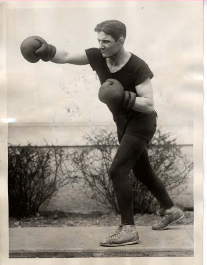 Pete Latzo Throws A Punch In The Air Wallpaper