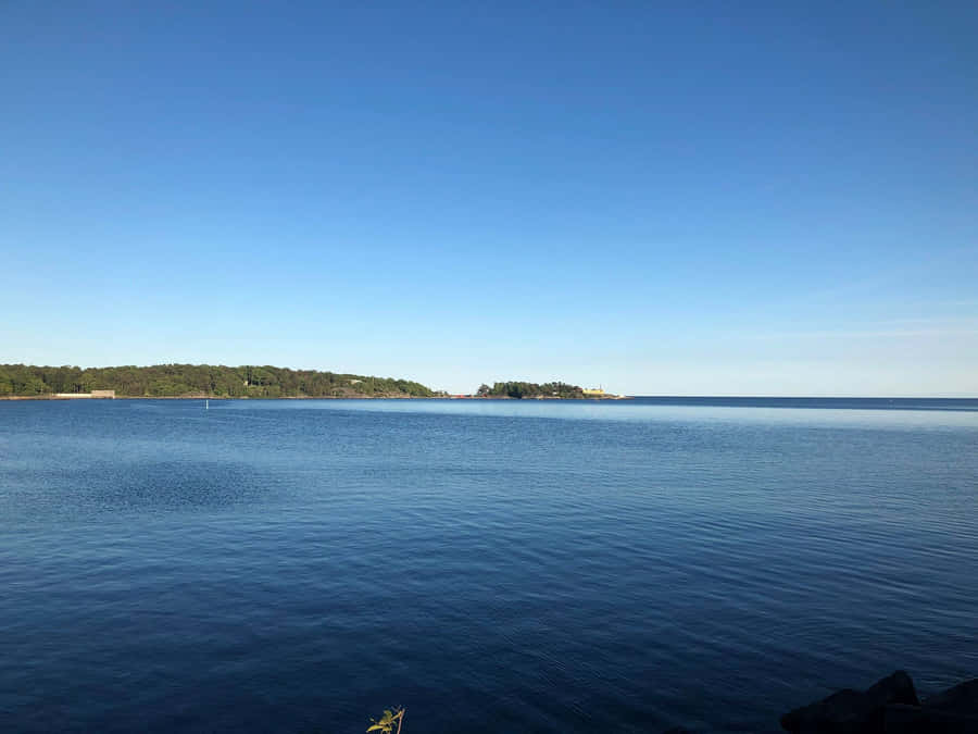 Picturesque Sunrise Over Karlshamn Port Wallpaper