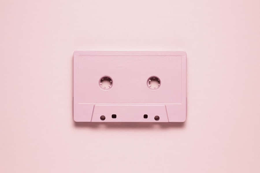 Pink Cassette Tapeon Pastel Background Wallpaper