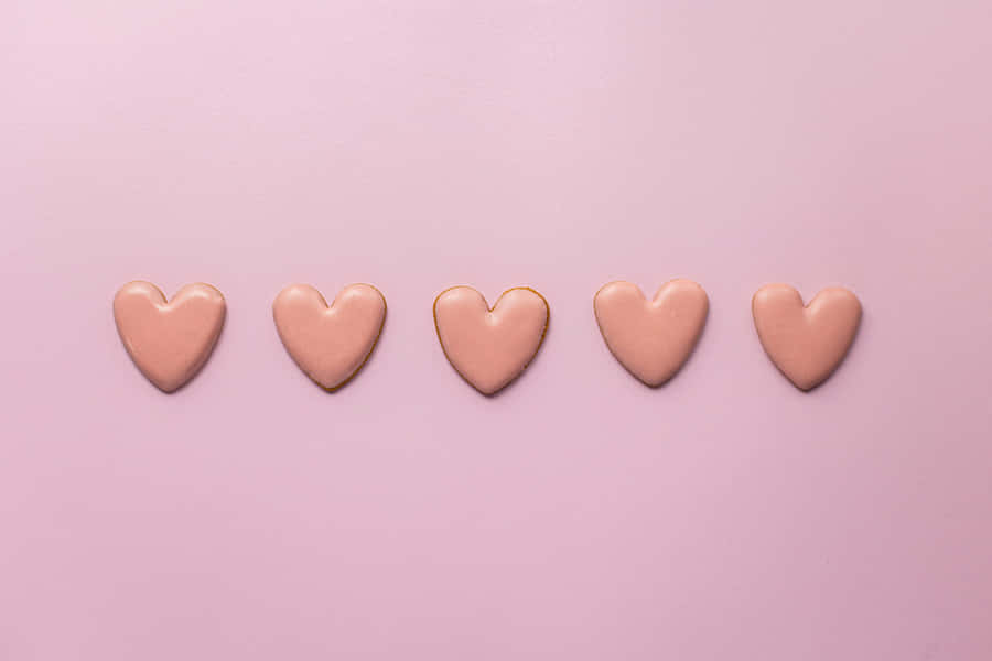 Pink Heartson Pastel Background Wallpaper
