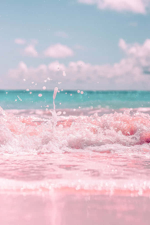 Pink Water Splashing On The Beach Wallpaper