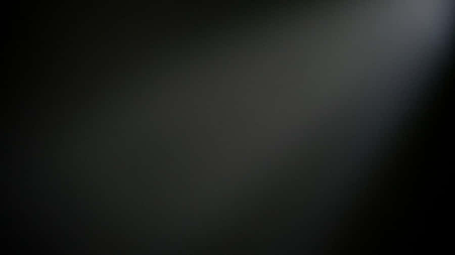 Plain Black Desktop With A Light Wallpaper