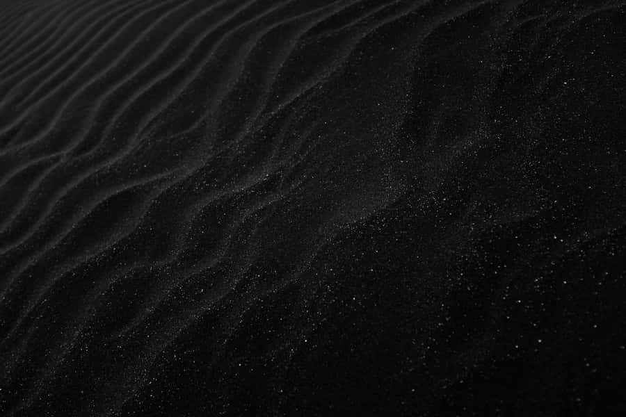 Plain Black Desktop With Sand Ridges Wallpaper