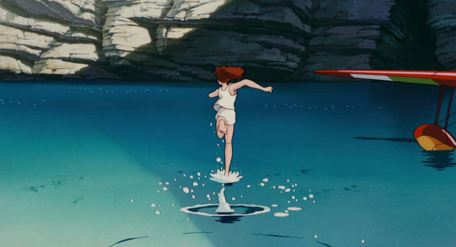 Porco Rosso Soaring Through The Sky In His Red Plane Wallpaper