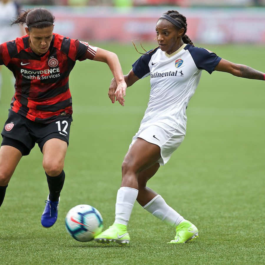Portland Thorns Fc In Intense Match Action Wallpaper