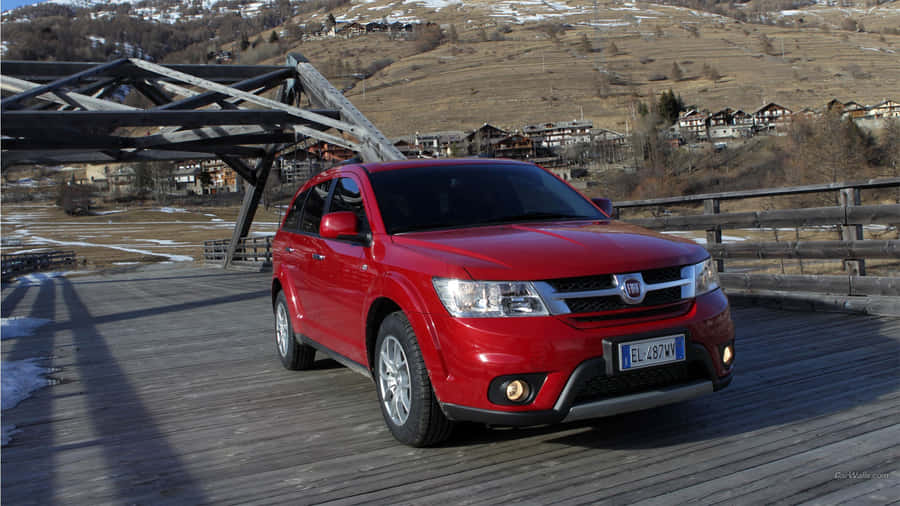 Powerful Fiat Freemont Cruising On Pathway Wallpaper